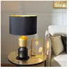 EGLO Lampe de table en céramique noir et dorée et abat jour tissu noir intérieur doré laurignano e27 40w
