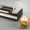 Conditionneuse sous vide avec rouleau et reglette de coupe integres
