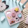 Puzzle encastrable sensoriel Après la pluie Moulin Roty
