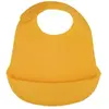 Trois Kilos Sept Bavoir en silicone Moutarde