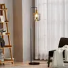 Lindby lampadaire Nimbora, 150 cm, noir, verre, métal