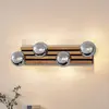 Lindby Applique murale Woodora, bois, verre, gris fumé, à 4 lampes