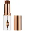 Charlotte Tilbury Unreal Skin Sheer Glow Tint - Stick Fond de teint Hy...