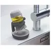 Brosse à vaisselle Joseph Joseph Palm Scrub avec réservoir intégré