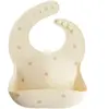 Mushie Bavoir à poche en silicone Pretzel