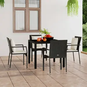 vidaXL Chaises de jardin 4 pcs avec coussins Résine tressée Noir pas cher