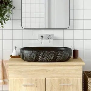 Comparateur de prix : vidaXL Vasque à poser noir ovale 59x40x14 cm céramique