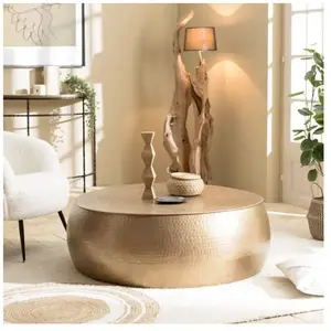 Comparateur de prix : MACABANE Johan - table basse ronde 106x106cm effet martelé aluminium doré