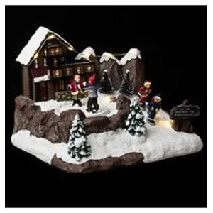 Comparateur de prix : ATMOSPHERA Village de Noël chalet et patineur animé 9 LED à piles Feeric lights & christmas