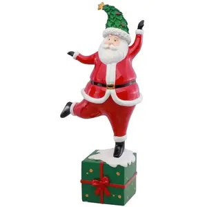RueDeLaFete Père Noël au chapeau vert sur paquet cadeau coloré en résine 36cm (x1) pas cher