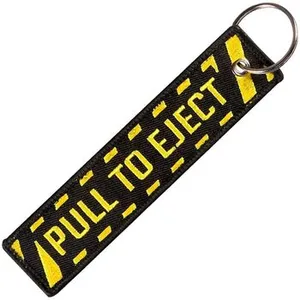 Comparateur de prix : CLJ - Porte-clés - PULL TO EJECT - Noir et jaune - Sécurité aviation - Urgence