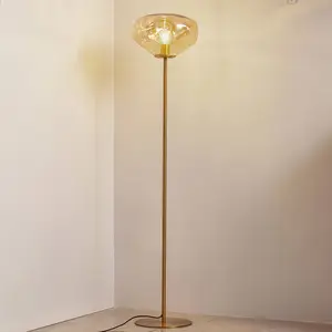 Comparateur de prix : Lindby lampe sur pied Lelia, ambre, verre, métal, 150 cm