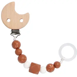 Comparateur de prix : LÄSSIG Attache-tétine wood/silicone Little Universe brown
