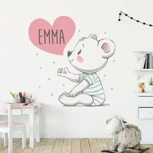 Ambiance-sticker Sticker prénom personnalisé ourson avec le coeur sur la mainVendu parambiance-sticker