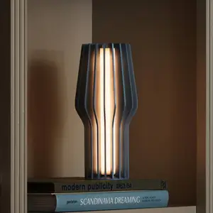 Comparateur de prix : EVA Solo Lampe à poser LED rechargeable Radiant, bleu, caoutchouc, IP4...