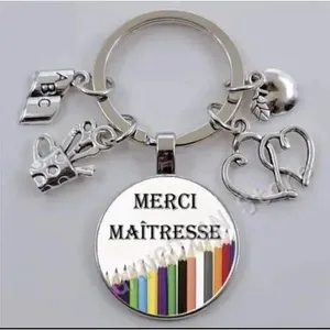 Comparateur de prix : Porte-clés Merci Maîtresse Cabochon en verre + pochette organza cadeau...