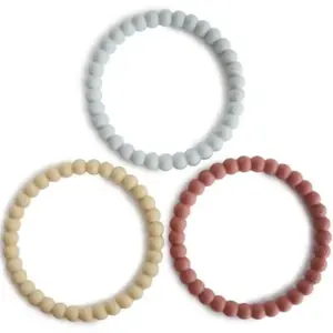 Mushie Anneau de Dentition Bébé | Gel Refrigerant | Jouet en Silicone Sans BPA | Bracelet Fleur | Lot de 3 | Accessoires Jeunes Enfants | Durable & Haute Qualité | Cambridge Blue/Clementine/Natural