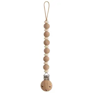 Comparateur de prix : Mushie Attache sucette Luna en bois