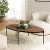 Image de MACABANE Basile - Table Basse Ovale 131x65cm Couleur Rouille Effet Pierre