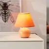 Image de Brilliant Lampe de table Primo, orange, Ø 19 cm, textile/céramique