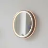 Image de Paul Neuhaus Miroir mural LED VIDRO, bronze, Ø 26 cm, batterie externe, interrupteur