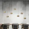 Image de Suspension LED PURE Falling Rings, bronze, longueur 132 cm, à 7 lampes.