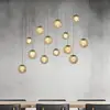 Image de Suspension LED PURE Popup, bronze/ambre, longueur 100 cm, 13 ampoules.