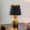 Image de Reality Leuchten Lampe à poser Pineapple en céramique noir et or