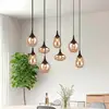 Image de Trio Lighting Suspension Lumina, à 8 lampes, noir/ambre, verre
