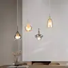 Image de Trio Lighting Suspension Aldea, longueur 65 cm, verre blanc/ambre/chrome, à 4 lampes.