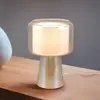 Image de Trio Lighting lampe de table Rocka, couleur ambre, hauteur 29 cm, verre/tissu