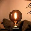 Image de Müller Licht tint white globe LED E27 4,9 W doré