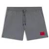 Image de HUGO Hommes Dominica Short de Bain à séchage Rapide avec étiquette Logo