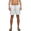 Image de Urban Classics Pattern Palm Short de Bain pour Homme Noir/Olive Basiques Streetwear, Logo Whitescript, 4XL