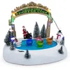 Image de Spetebo Scène de Noël patinoire à LED avec tasses à café avec musique - 27 x 21 cm - Scène de ville d'hiver éclairée à piles - Décoration de table de Noël