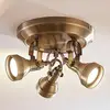 Image de Lindby plafonnier Perseas, Ø 22cm, 3 lampes, laiton vieilli, GU10