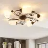 Image de Lindby plafonnier Stefania, 5 lampes, noir/or, Ø58cm