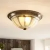 Image de Lindby Plafonnier LED Henja, laiton vieilli, Ø 32 cm, intensité variable
