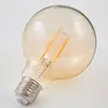 Image de Lindby Ampoule globe LED E27 à filament 6 W 500 lm, ambre 1 800 K