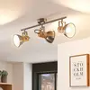 Image de Lindby Plafonnier Dennis avec bois, à 3 lampes, long