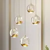 Image de Lucande Suspension LED Hayley, Ø 30 cm, 5 lampes, or, verre