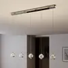 Image de Lucande Suspension LED Hayley, 96 cm, à 5 lampes, chrome, verre