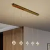 Image de Lucande Suspension LED Hayley, 96 cm, 5 lampes, or, verre