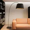 Image de Lindby lampe sur pied Esti, noir/or, tissu, hauteur 192cm