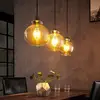 Image de Lindby suspension Tymoni, 3 lampes, ambre, verre, Ø 20 cm