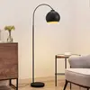 Image de Lindby lampadaire arqué Minali, noir, métal, 148 cm de haut, E27