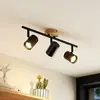 Image de Lindby plafonnier Xiomara, 3 lampes, longueur 68 cm, bois