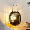 Image de Lindby lampe de table Canyana, noir, rotin, hauteur 27 cm