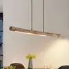 Image de Suspension LED Lindby Nekala, noire, en bois, longueur 120 cm