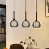 Image de Lucande Tetira suspension 3 lampes allongée noire